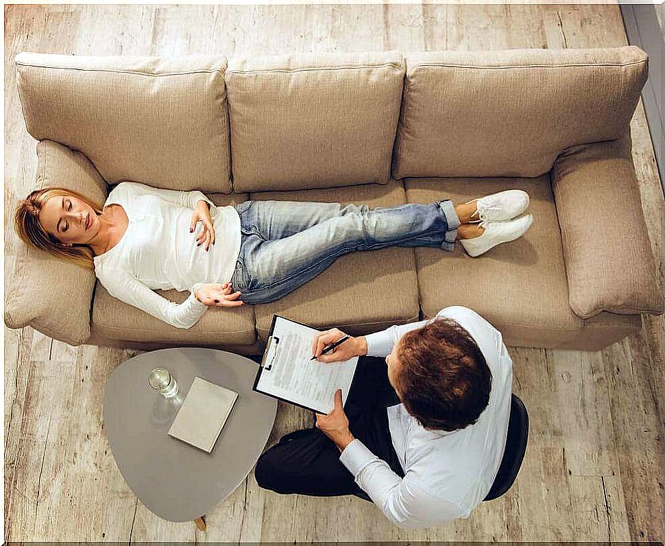 Woman on sofa has emotional distress