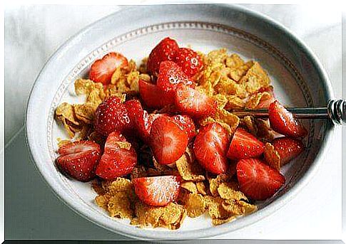 Cereal products and strawberries for a healthy breakfast