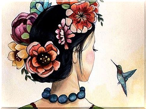 Woman with flowers in her hair thinks about her life